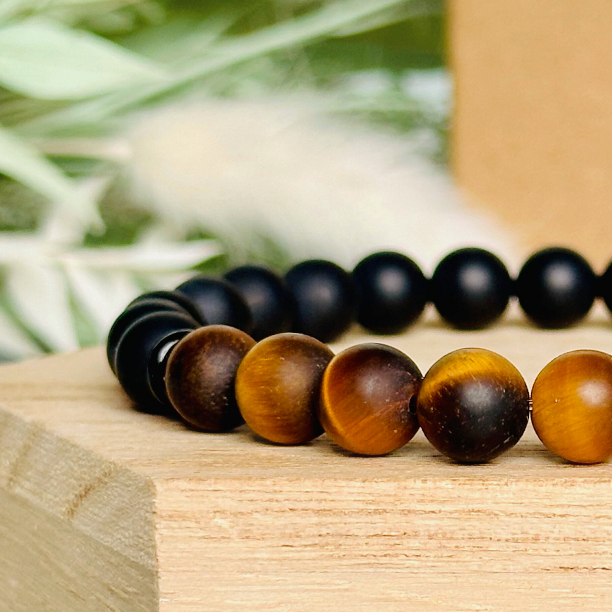 Men’s crystal bracelet featuring 8mm matte black onyx beads, 8mm matte tigers eye beads with black agate spacer beads.