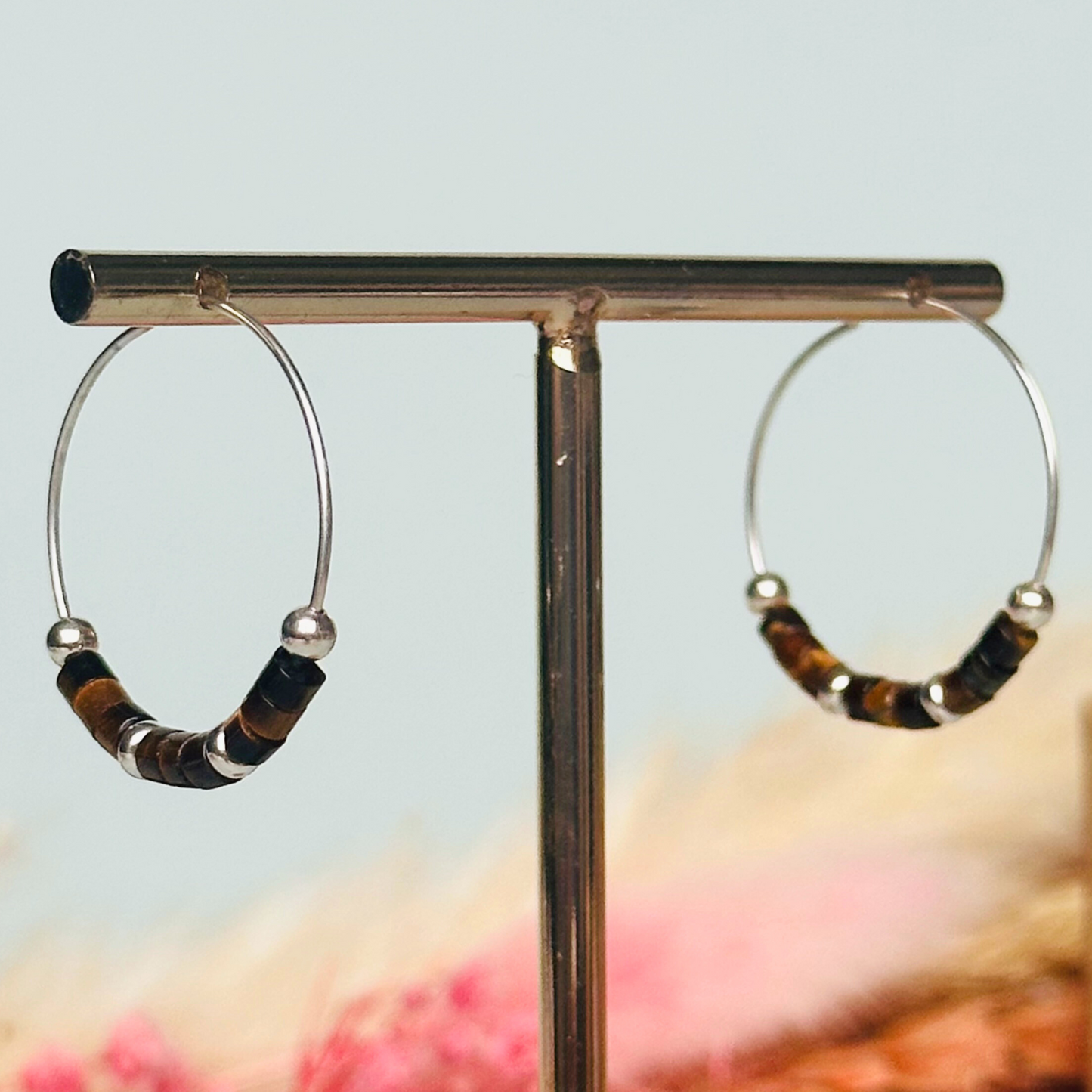 Tigers eye sterling silver hoop earrings with ethically mined tigers eye heishi beads on 25mm sterling silver hoops.
