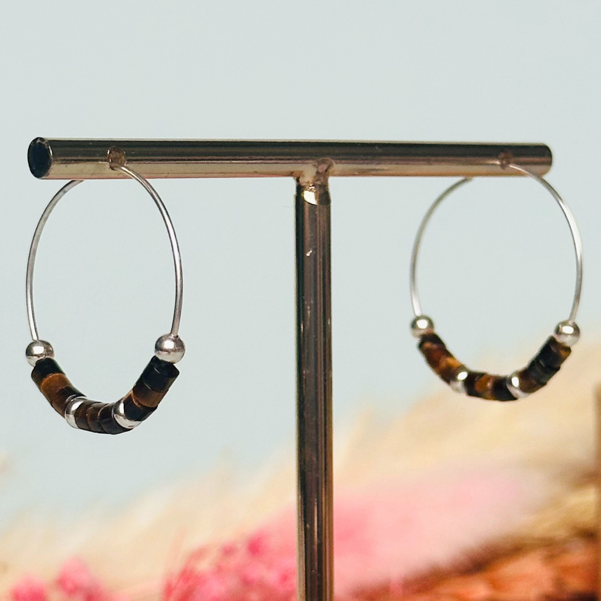 Tigers eye sterling silver hoop earrings with ethically mined tigers eye heishi beads on 25mm sterling silver hoops.