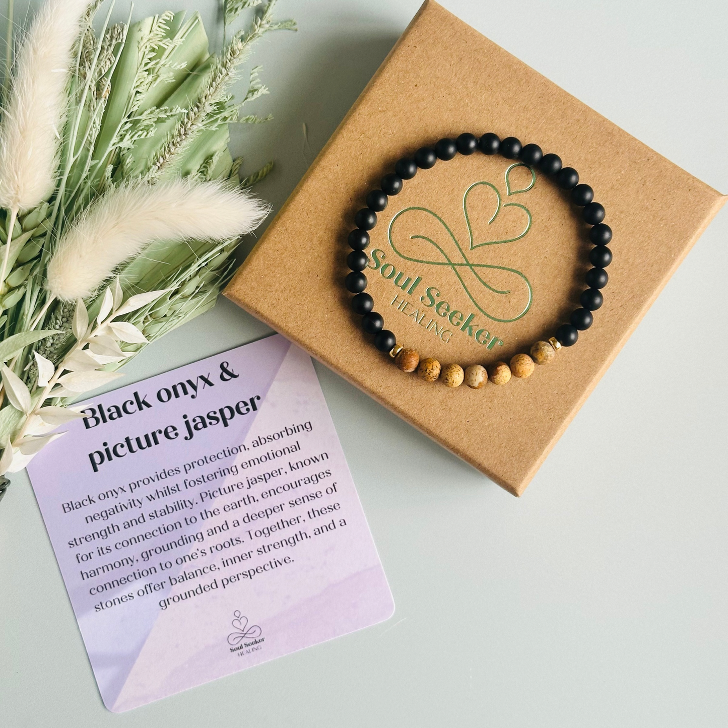 Men’s crystal bracelet featuring 6mm matte black onyx beads, 6mm matte picture jasper beads with gold vermeil spacer beads.