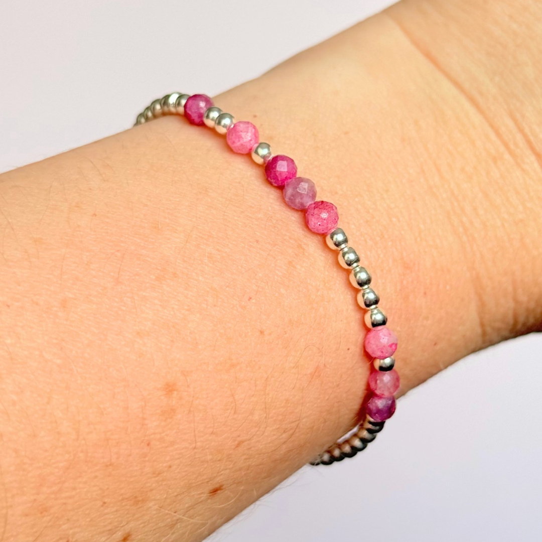 Morse code secret message bracelet spelling out your chosen name in sterling silver and pink tourmaline crystal beads. Elasticated with 4mm faceted pink tourmaline beads and 3mm sterling silver beads. Custom October birthstone bracelet.