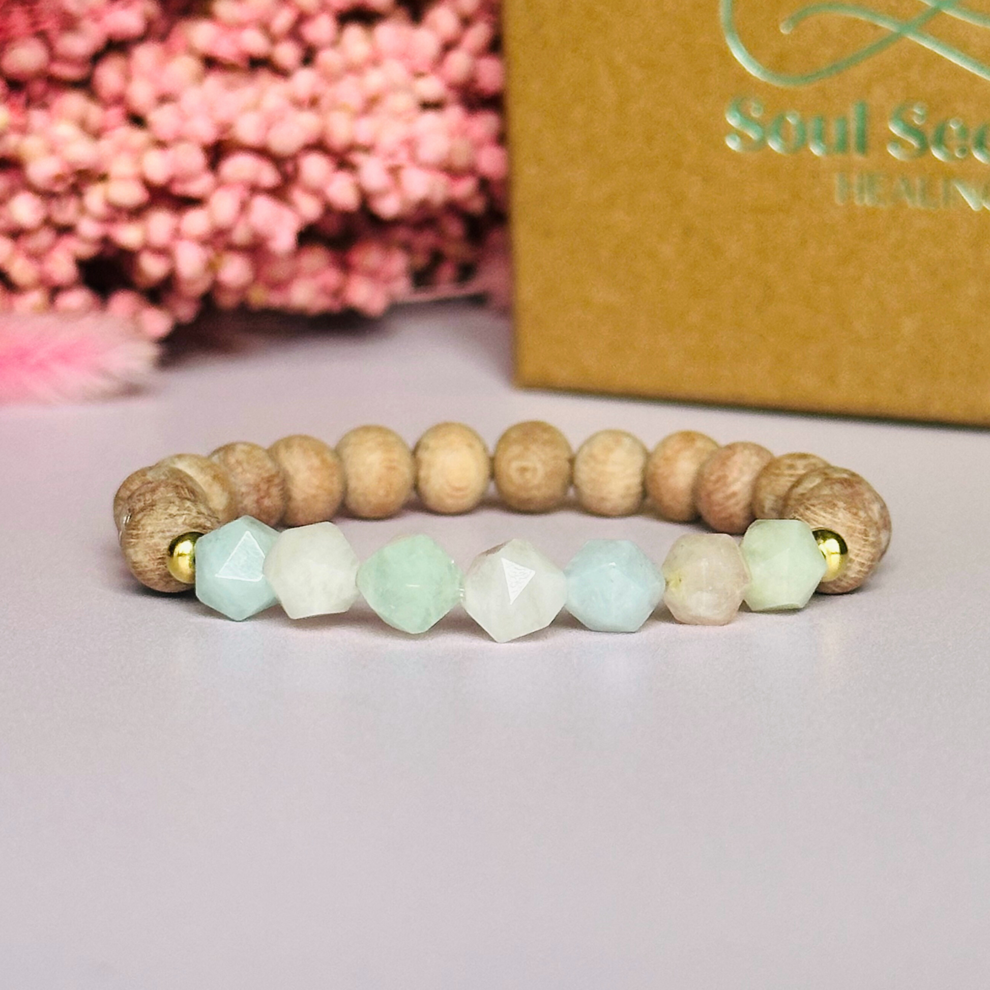 Morganite and raw rosewood elasticated essential oil diffuser bracelet. Made with 8mm star cut morganite beads, 8mm round raw rosewood beads and your choice of sterling silver, gold vermeil or rose gold vermeil spacer beads