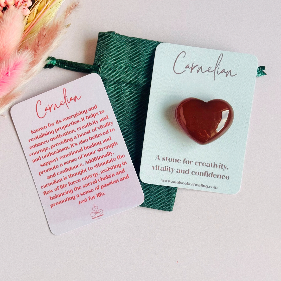 A beautiful ethically mined carnelian heart, presented on an eco-friendly textured card with the words 'A stone for creativity, vitality and confidence.' This heart shaped carnelian crystal measures approximately 25mm x 25mm.