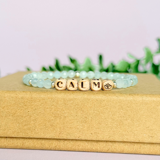 Bracelet featuring 5mm engraved wooden beads which you can personalise with your choice of words, numbers and symbols. The main the band of the bracelet is made with 4mm faceted aquamarine round crystal gemstone beads. Finished with your choice of gold vermeil, sterling silver or rose gold vermeil accent beads.