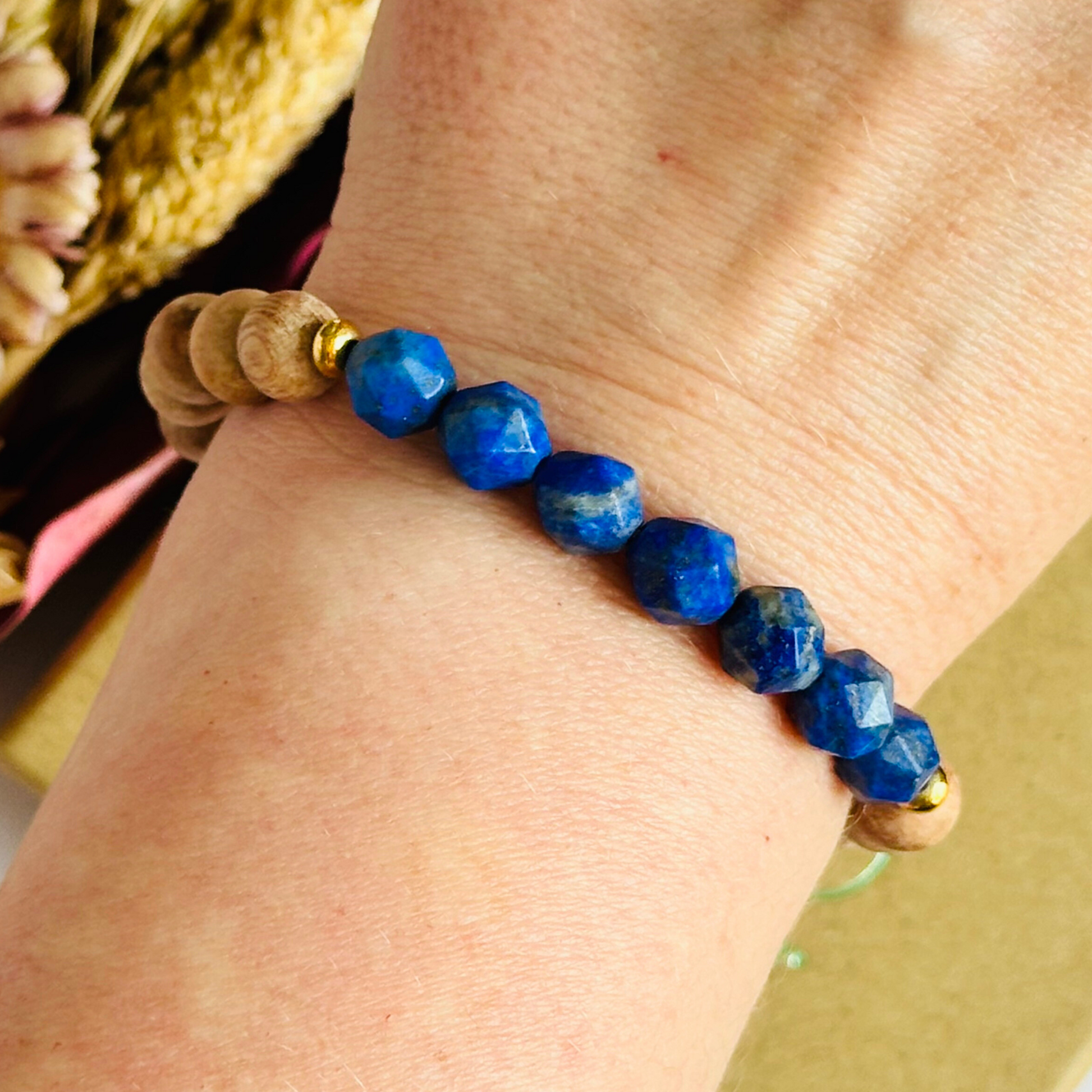 Lapis lazuli and raw rosewood elasticated essential oil diffuser bracelet. Made with 8mm star cut lapis lazuli beads, 8mm round raw rosewood beads and your choice of sterling silver, gold vermeil or rose gold vermeil spacer beads