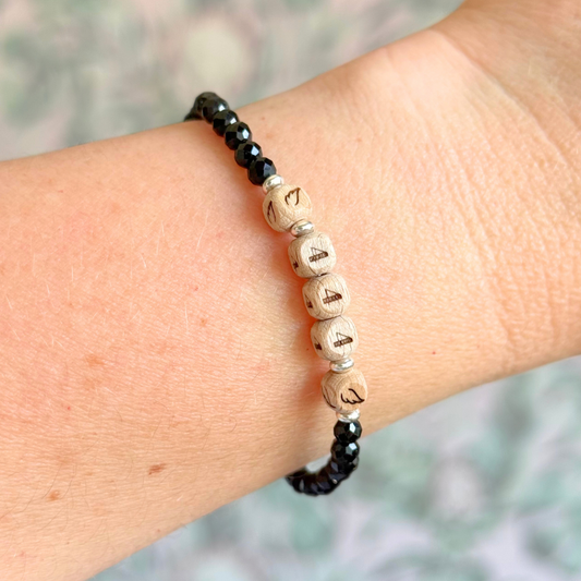 Bracelet featuring engraved wooden 444 angel number and wing beads, on the band of 4mm faceted black tourmaline round crystal gemstone beads. Finished with your choice of gold vermeil, sterling silver or rose gold vermeil accent beads.