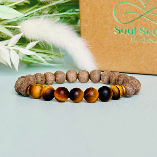 Mens crystal healing bracelet featuring 8mm matte tigers eye beads, sandalwood spacer beads and raw grey wood beads.