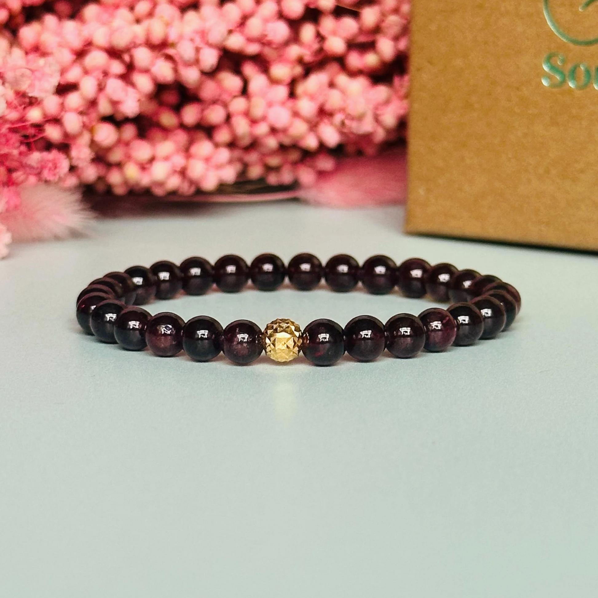 Garnet bracelet with a faceted sterling silver or gold vermeil focal bead. A bracelet for passion, success and confidence. Made with 6mm beads.