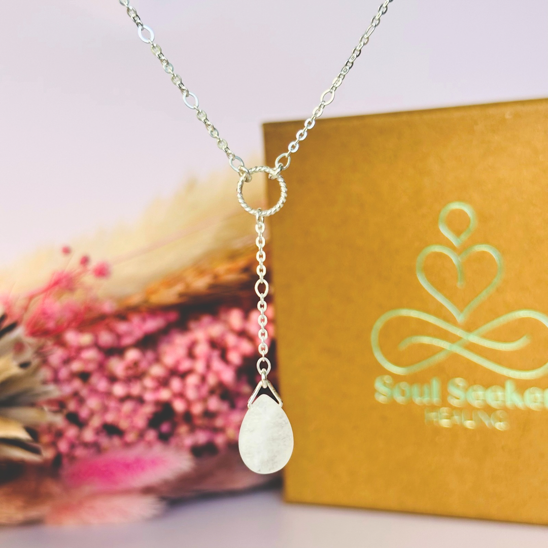 Moonstone necklace features a faceted moonstone teardrop bead on a delicate sterling silver figaro chain with a twisted sterling silver ring focal point. The necklace fastens with a subtle yet secure sterling silver bolt clasp. The teardrop bead measures 12mm x 8mm.