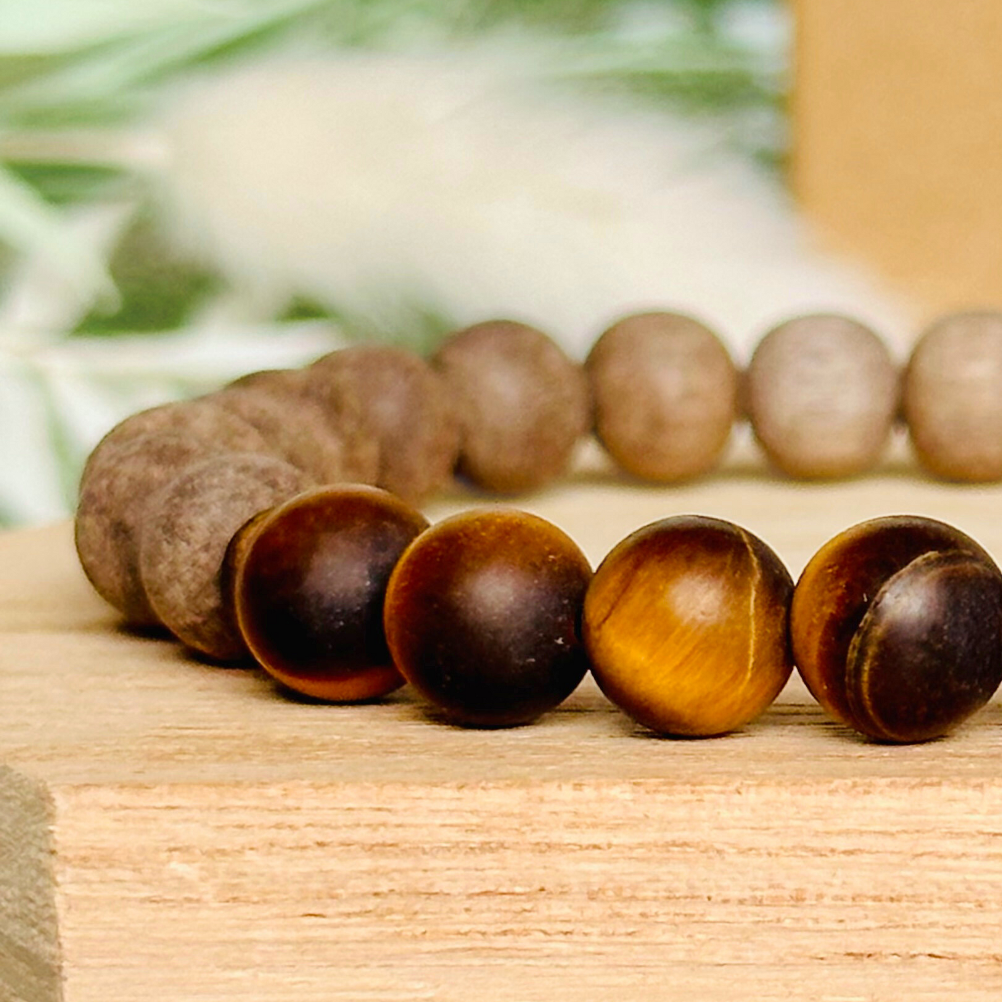 Mens crystal healing bracelet featuring 8mm matte tigers eye beads, sandalwood spacer beads and raw grey wood beads.