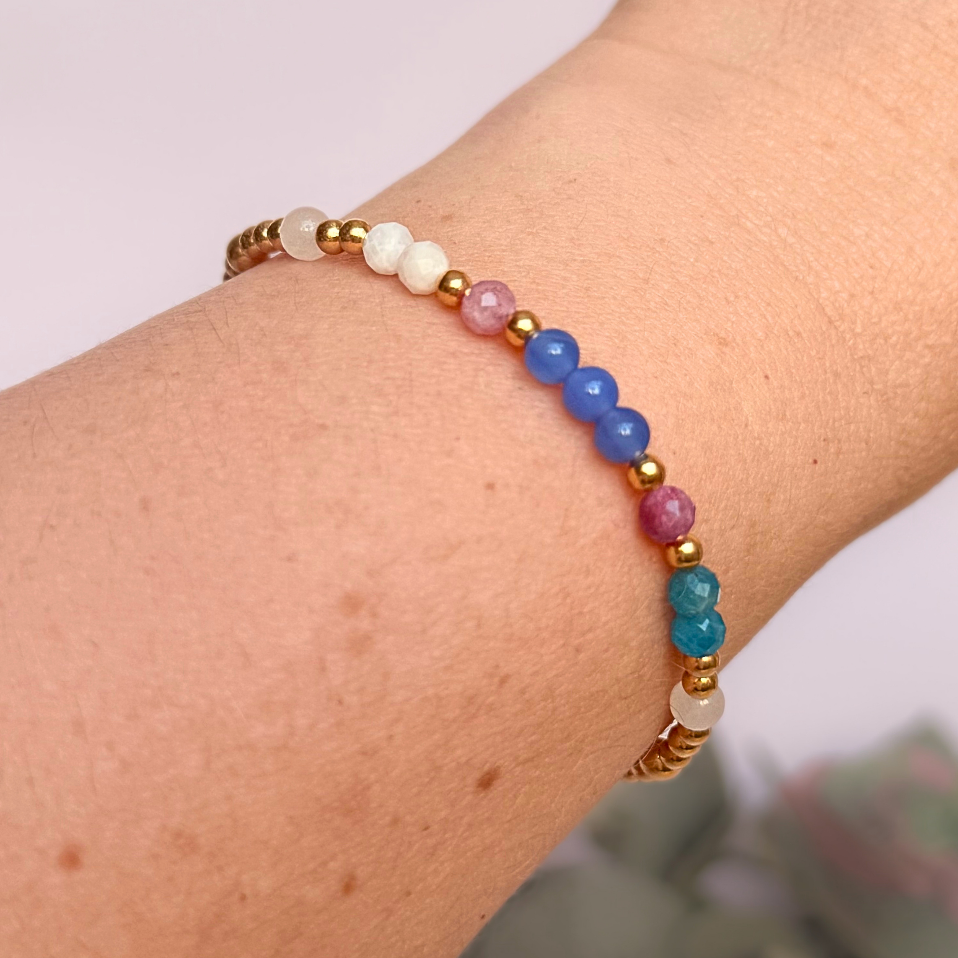‘Santorini' gold vermeil dainty beaded bracelet with pink tourmaline, rainbow moonstone, blue agate, apatite and white jade. Made with round 3mm gold vermeil beads and 4mm smooth and faceted round crystal gemstone beads. Pictured being worn