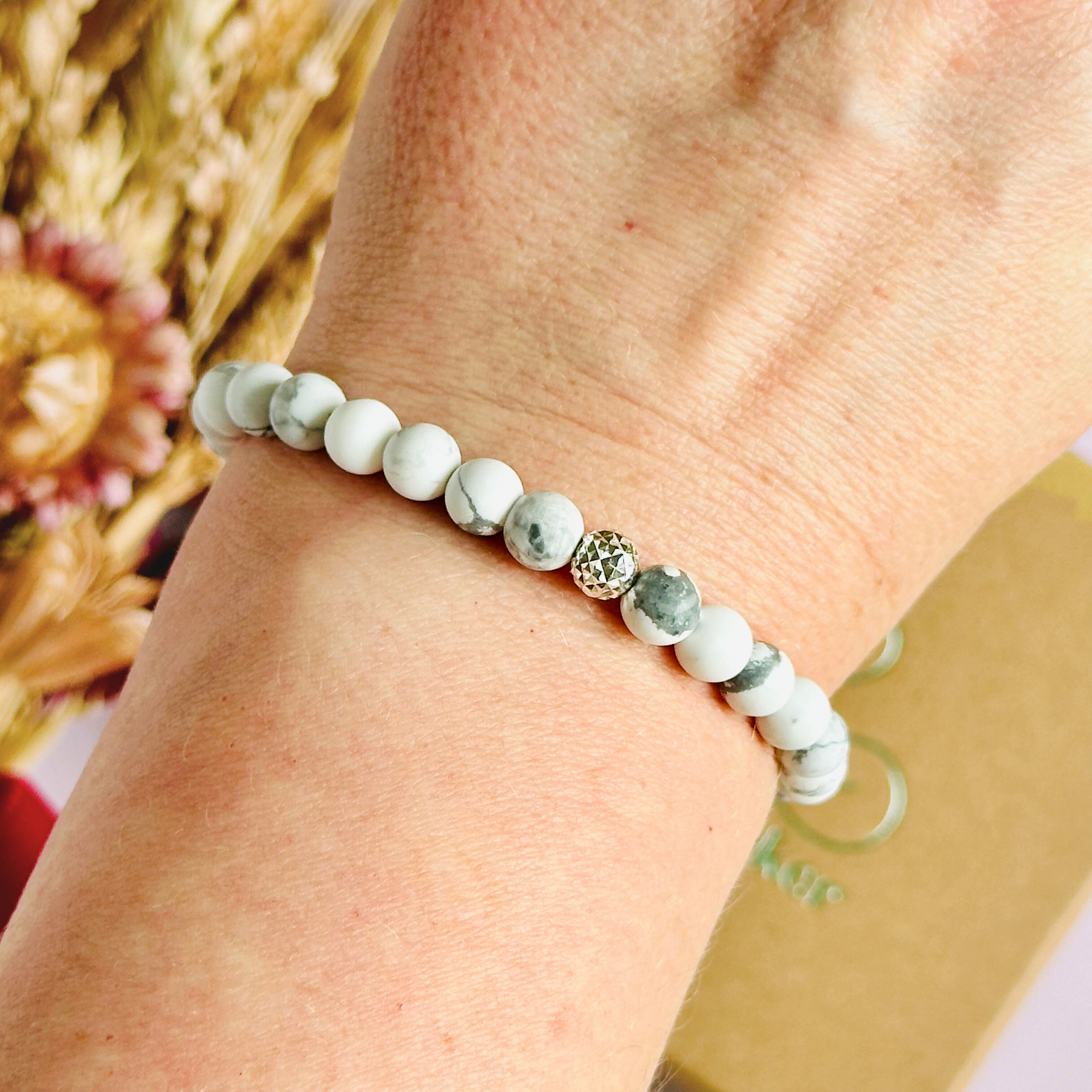 This howlite bracelet is made with ethically mined frosted howlite smooth crystal beads and features your choice of a sterling silver or gold vermeil faceted focal bead. A bracelet for emotional healing, calm and memory. All beads are 6mm.