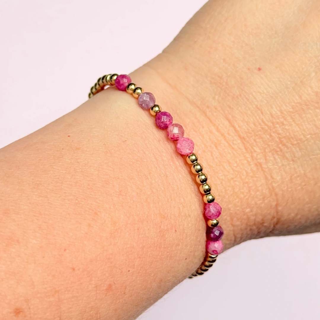 Morse code secret message bracelet spelling out your chosen name in gold filled and pink tourmaline crystal beads. Elasticated with 4mm faceted pink tourmaline beads and 3mm gold filled beads. Custom October birthstone bracelet.