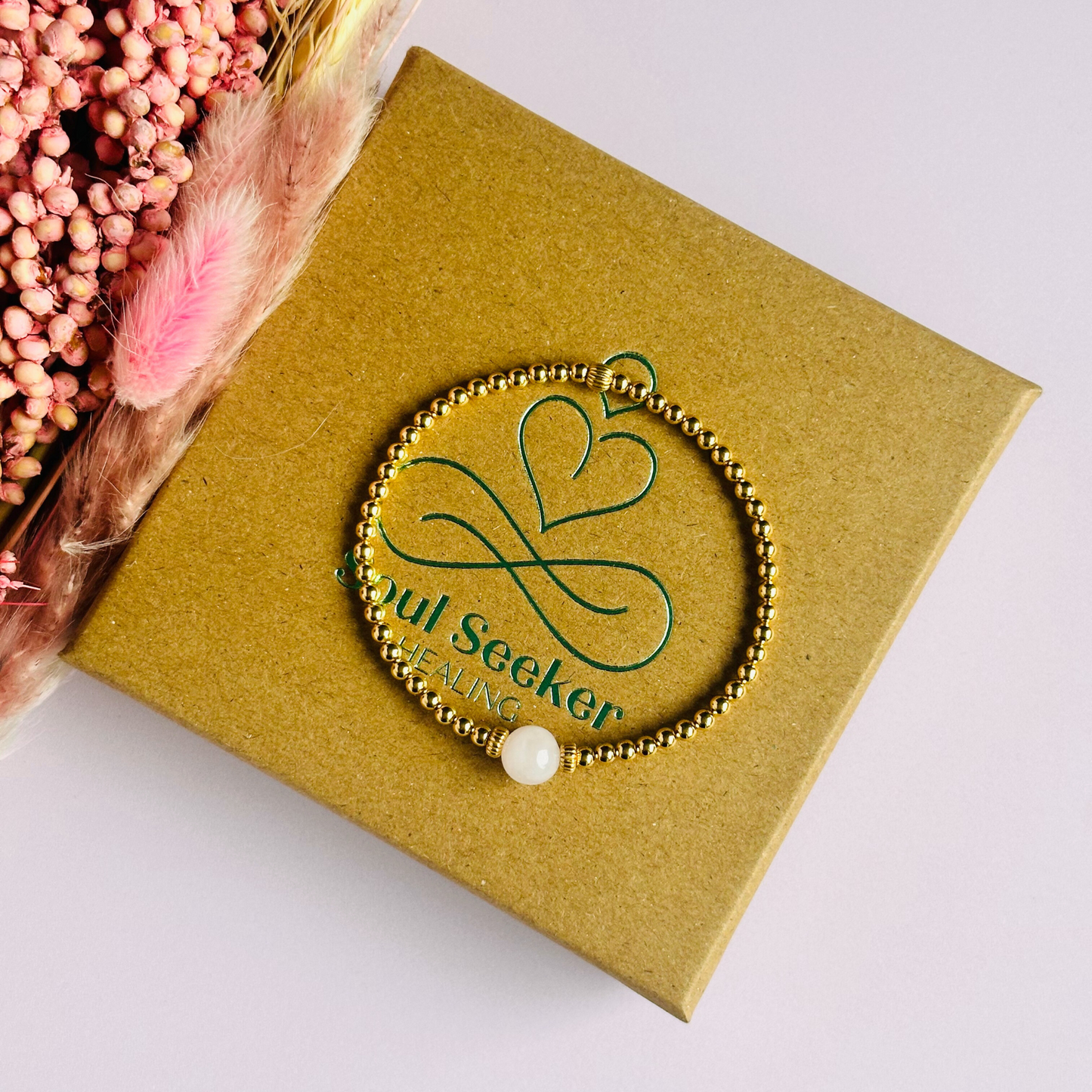 Gold vermeil rose quartz  bracelet features an ethically mined 8mm rose quartz bead, flanked by corrugated rondelle beads on a band of 3mm gold vermeil beads. A bracelet to promote self love and self-confidence.