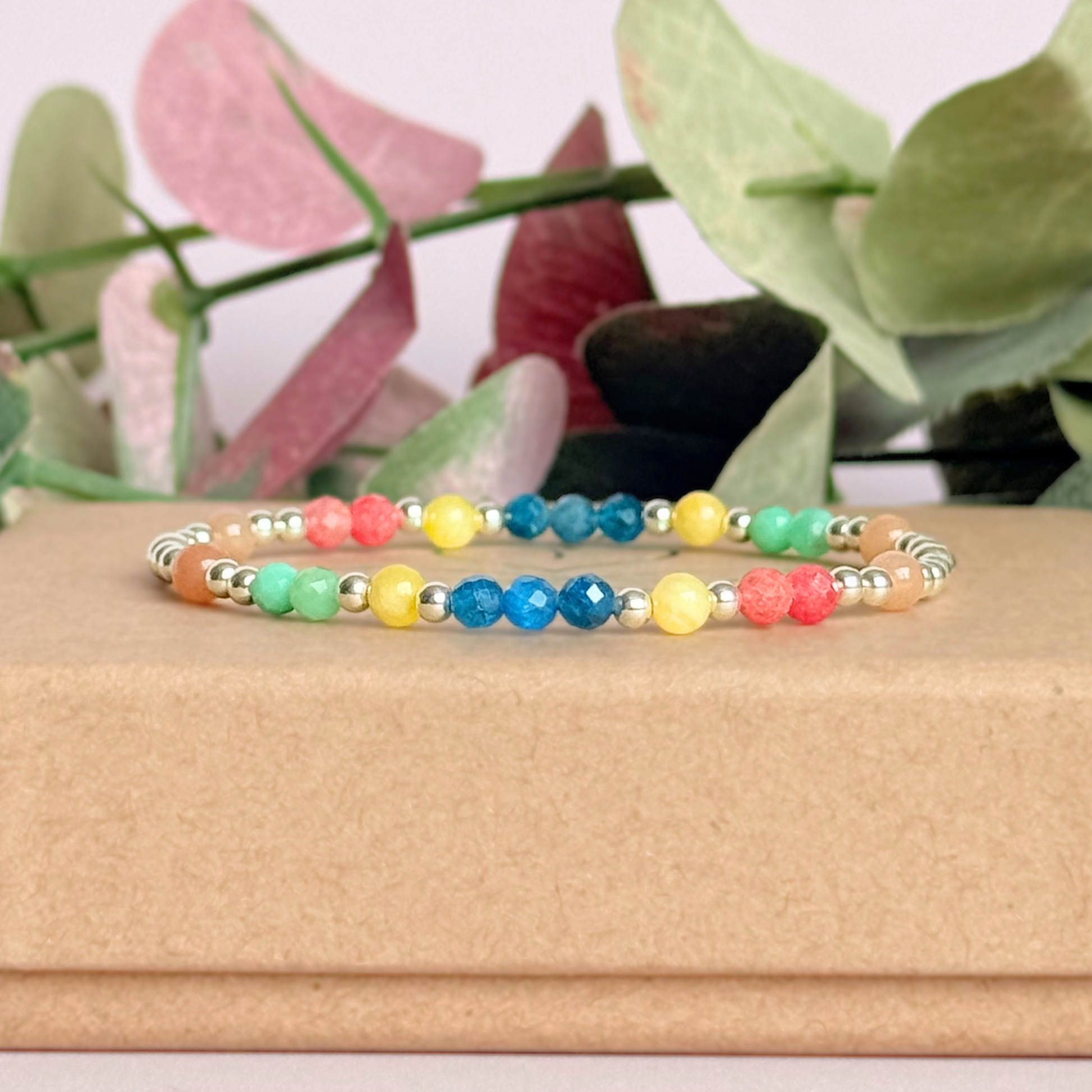 'Key West' sterling silver dainty beaded bracelet with apatite, rhodochrosite, yellow calcite, chrysoprase and peach moonstone. Made with round 3mm sterling silver beads and 4mm smooth and faceted round crystal gemstone beads. Pictured on the box