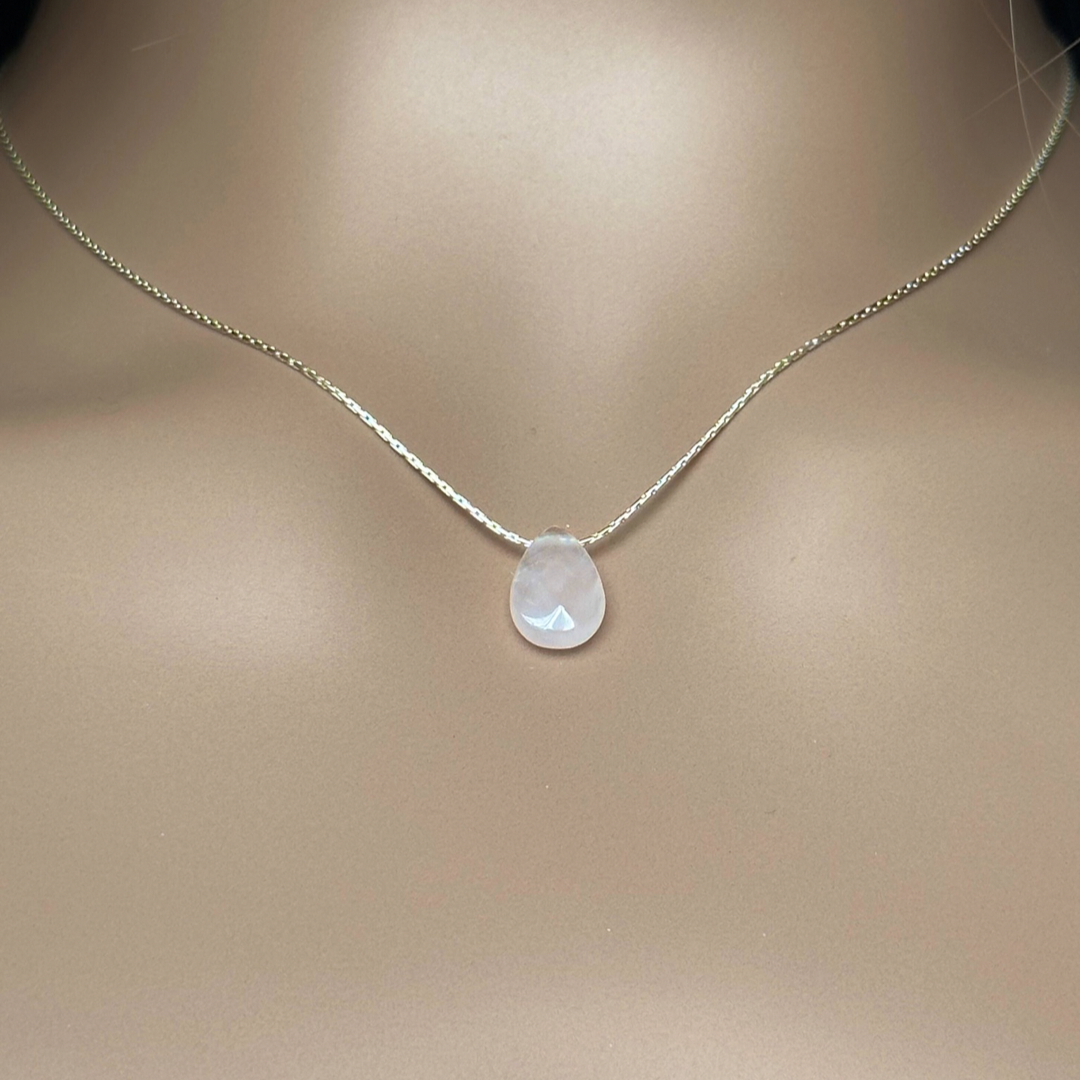 Dainty rose quartz teardrop necklace featuring a 12x8mm faceted rose quartz teardrop bead on a fine sterling silver beading chain.