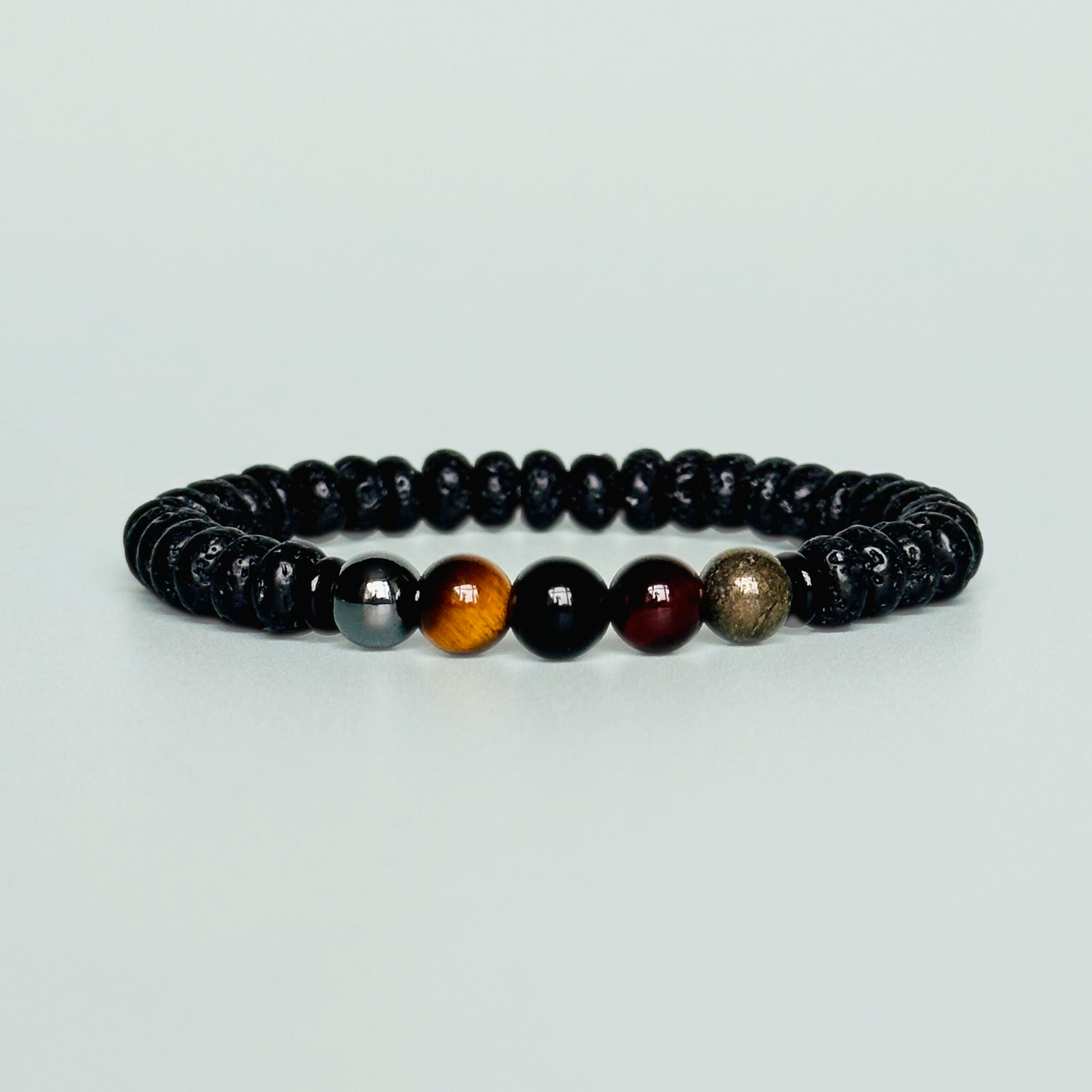 Mens crystal bracelet made with black lava beads and 8mm hematite, sardonyx, tigers eye, black obsidian and pyrite beads. All crystals are believed to be great crystals for men and make a great gift for him. Bracelet for men.