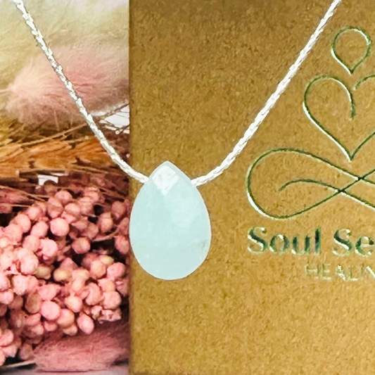 Dainty aquamarine teardrop necklace featuring a 12x8mm faceted aquamarine teardrop bead on a fine sterling silver cardano beading chain.