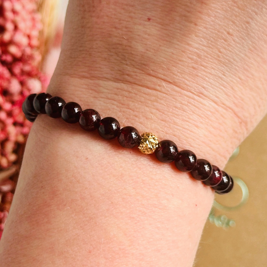 Garnet bracelet with a faceted sterling silver or gold vermeil focal bead. A bracelet for passion, success and confidence. Made with 6mm beads.