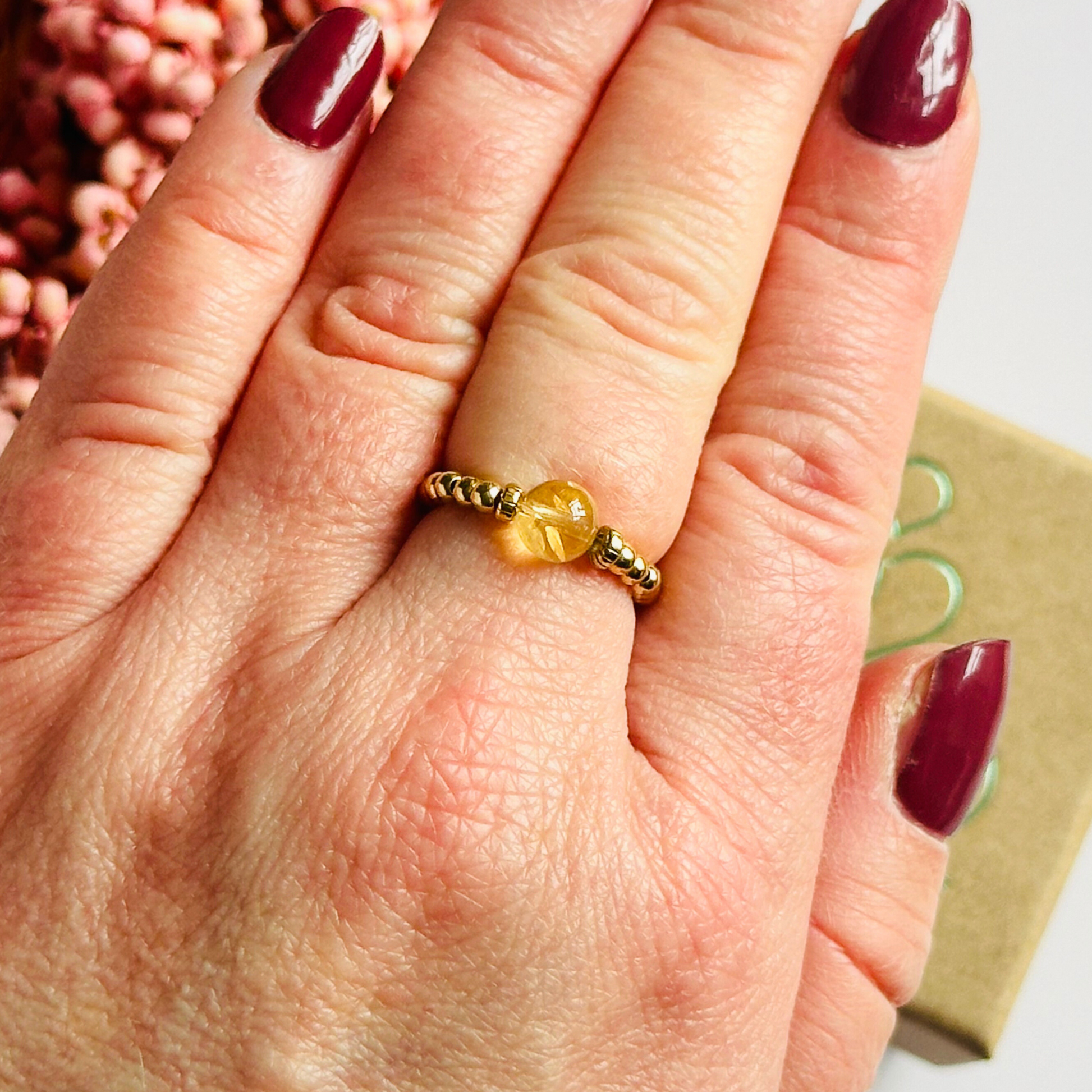 Citrine ring featuring a 6mm round citrine bead, flanked by gold vermeil rondelle beads on a gold vermeil elasticated band. November birthday ideas, November birthday gift, November birthstone ring, stretch ring, November jewellery, born in November