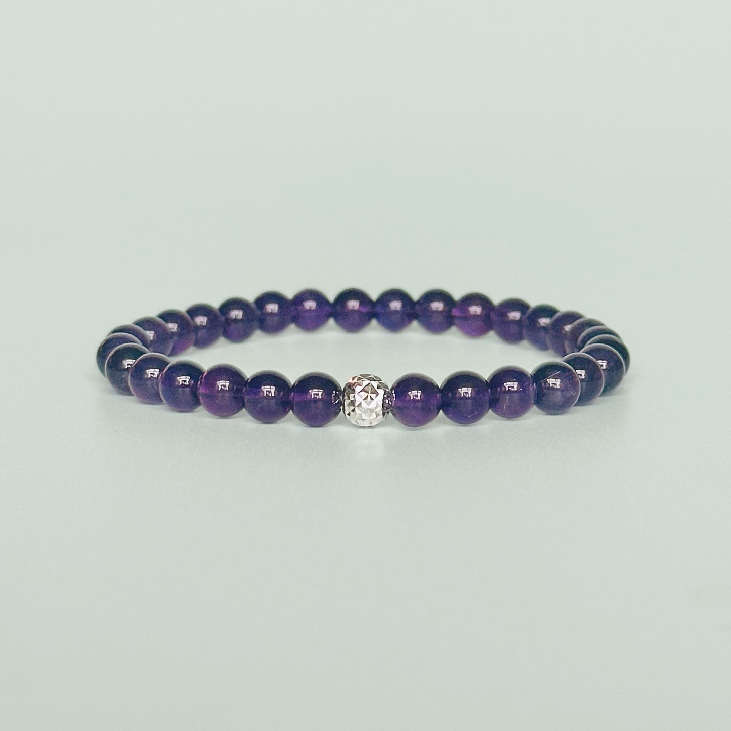 Amethyst bracelet with a faceted sterling silver or gold vermeil focal bead. A bracelet for anxiety relief, inner peace and to calm the mind. Made with 6mm beads.