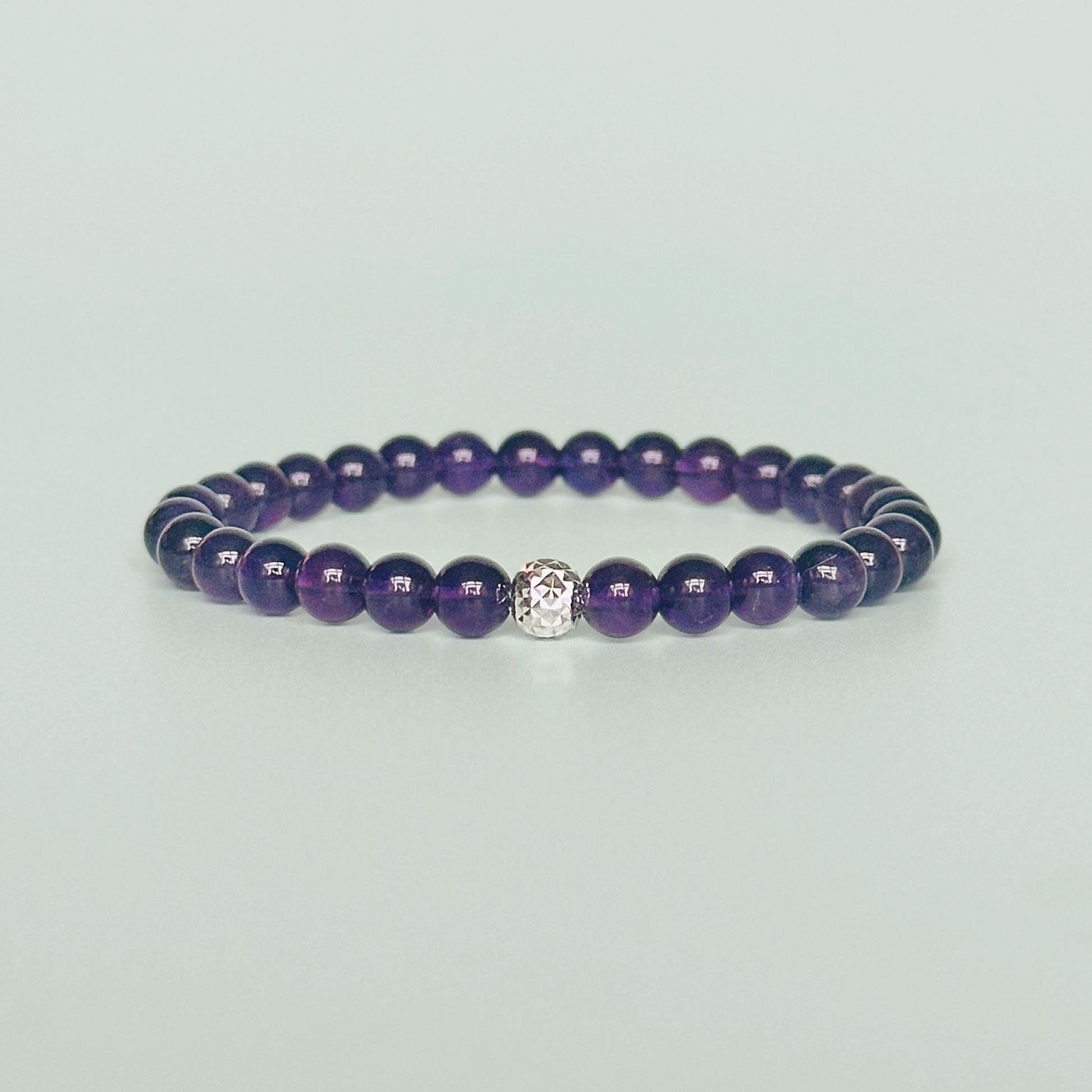 Amethyst bracelet with a faceted sterling silver or gold vermeil focal bead. A bracelet for anxiety relief, inner peace and to calm the mind. Made with 6mm beads.