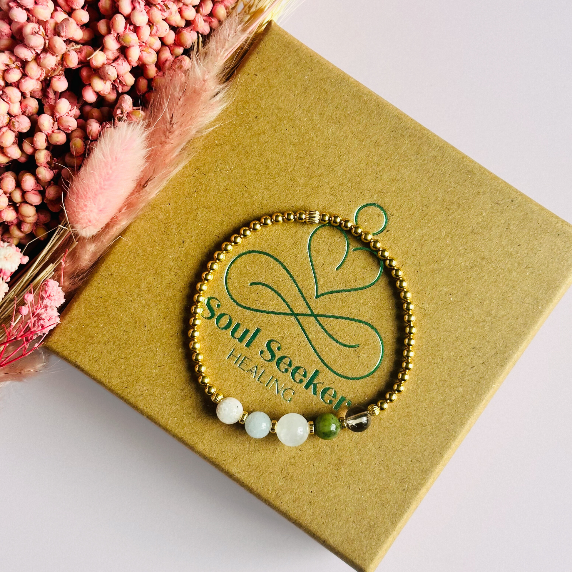 This gold vermeil Virgo bracelet is made with a selection of five healing crystals all believed to resonate with the Virgo zodiac sign. The central bead is 8mm, the other four are 6mm. On an elasticated band of 3mm gold vermeil beads with corrugated accent beads. Featuring amazonite, carnelian, moonstone, moss agate and sardonyx.