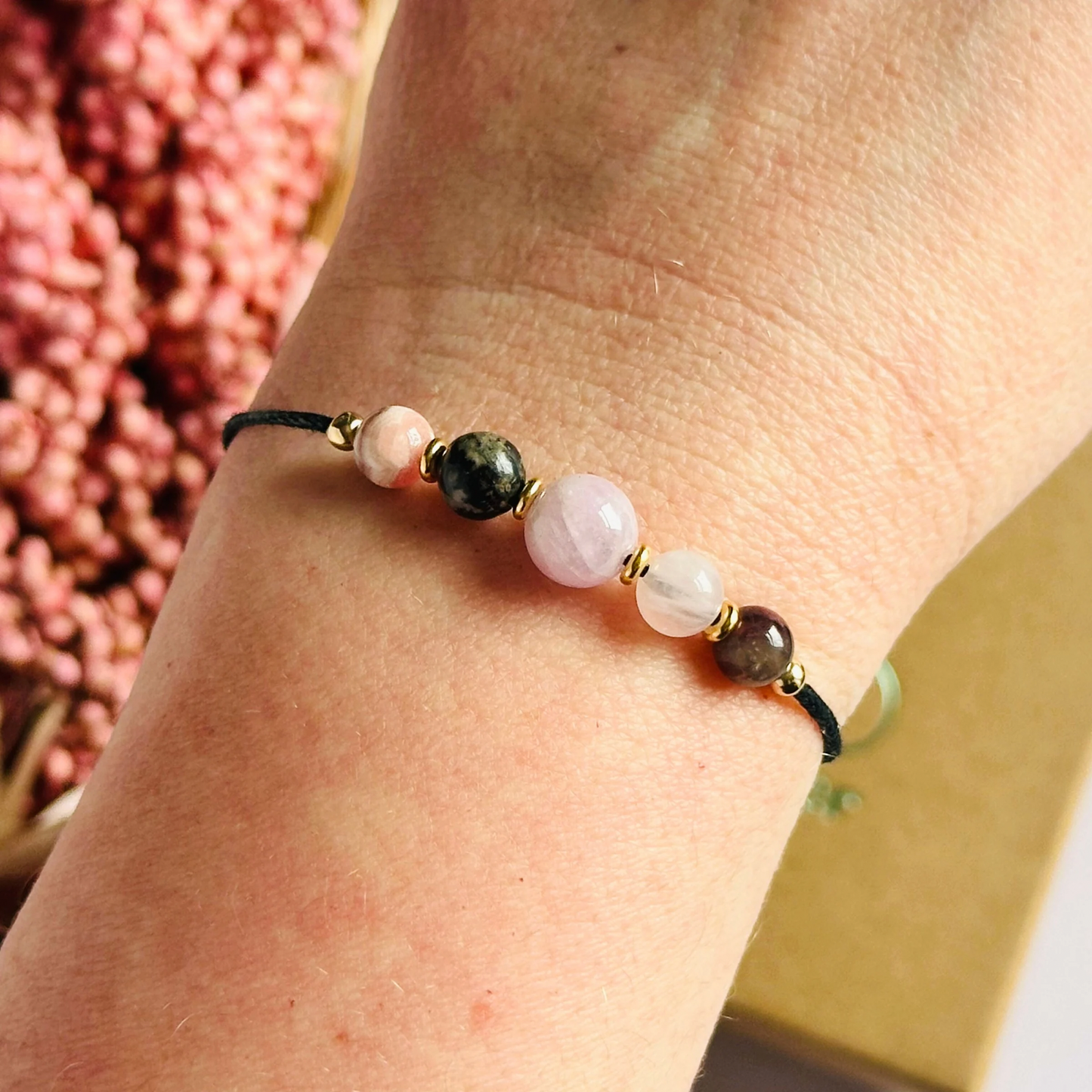Cord bracelet made with five crystals all believed to help with self-love. Including kunzite, rubellite, rose quartz, rhodonite and rhodochrosite. With your choice of cord colour and choice of either sterling silver, gold vermeil or rose gold vermeil accent beads. Vegan friendly waxed cotton cord.