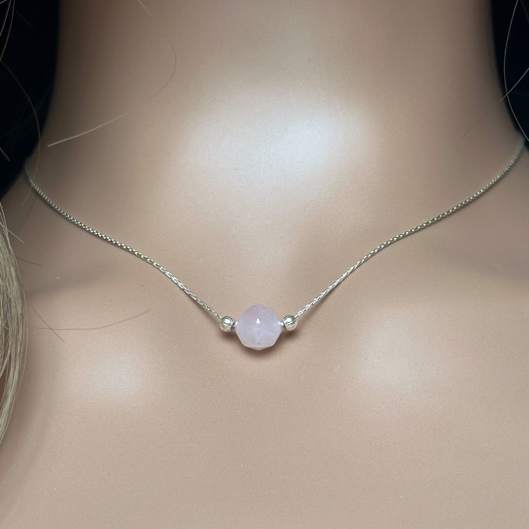 Rose quartz necklace featuring an 8mm star cut rose quartz bead with corrugated sterling silver beads on a delicate sterling silver cardano beading chain. The necklace fastens with a subtle yet secure sterling silver bolt clasp.