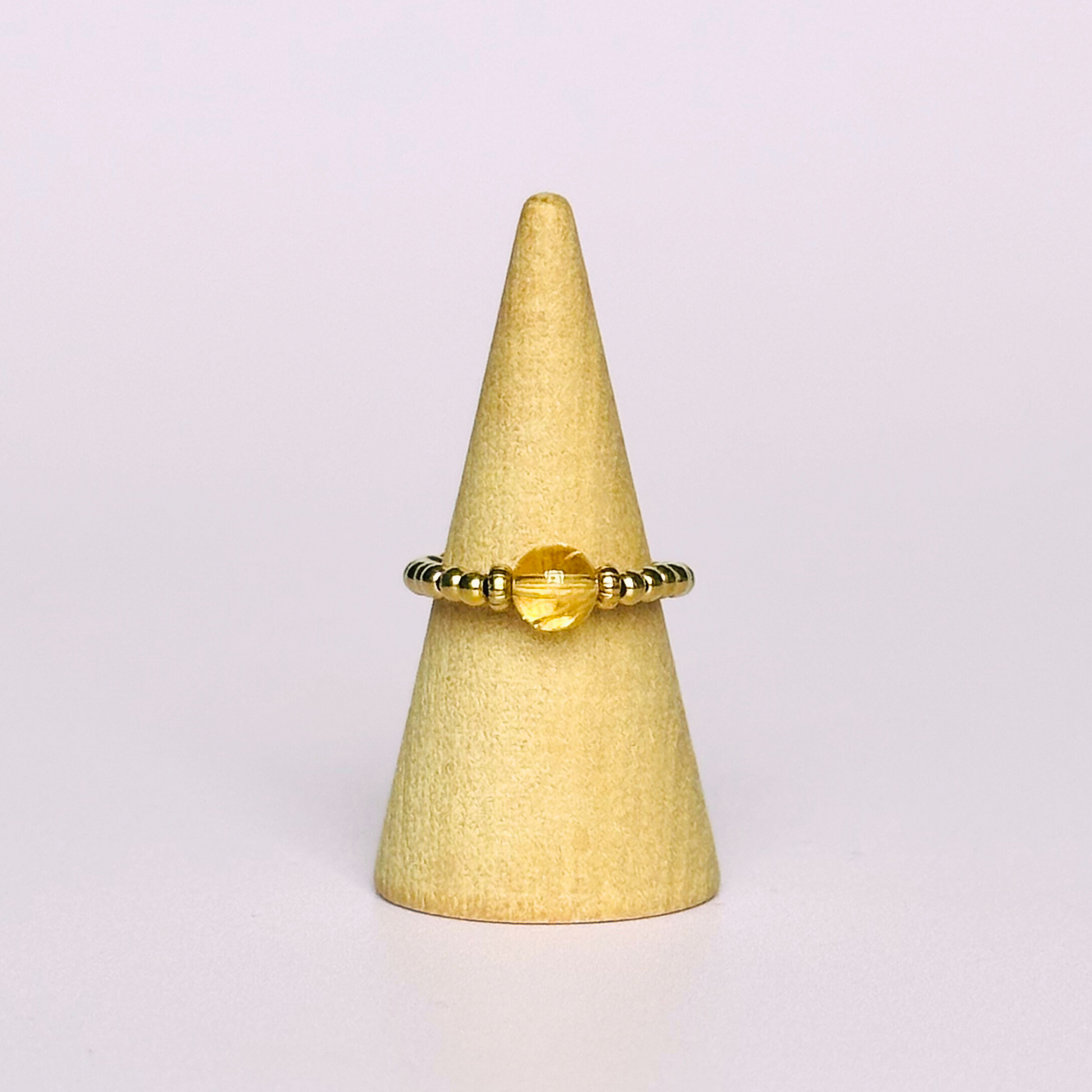 Citrine ring featuring a 6mm round citrine bead, flanked by gold vermeil rondelle beads on a gold vermeil elasticated band. November birthday ideas, November birthday gift, November birthstone ring, stretch ring, November jewellery, born in November