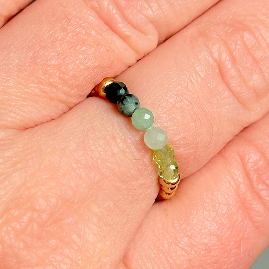 Gold vermeil band style ombré ring with multicolour 3mm faceted peridot, green aventurine and emerald beads with a beaded band of 2.5 mm gold vermeil round beads. Elasticated for comfort.