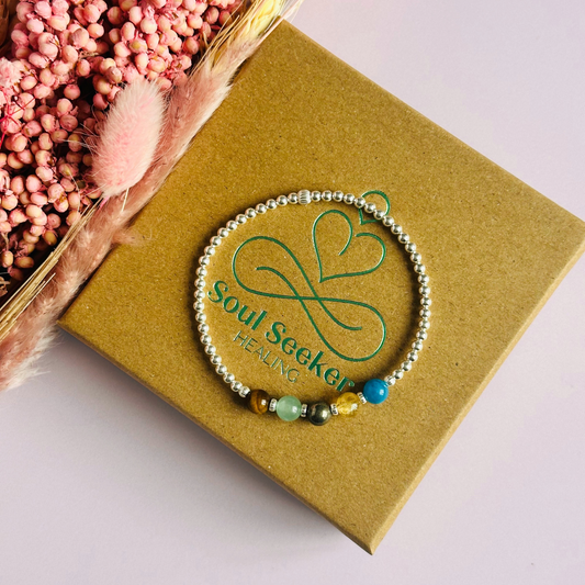 This sterling silver manifesting bracelet is made with a selection of five healing crystals all believed to help achieve your dream life. The crystal beads are all 6mm and are on a band of 3mm sterling silver beads with corrugated accent beads.
