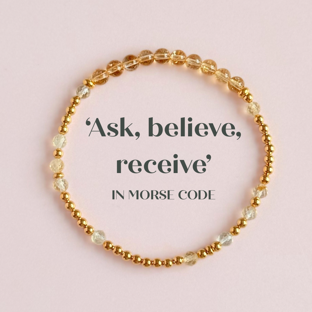 Citrine morse code bracelet that spells out the words ‘Ask, believe, receive’ in a combination of 4mm round smooth and faceted crystal beads with your choice of sterling silver or gold vermeil accent beads. shown in gold, pictured from above