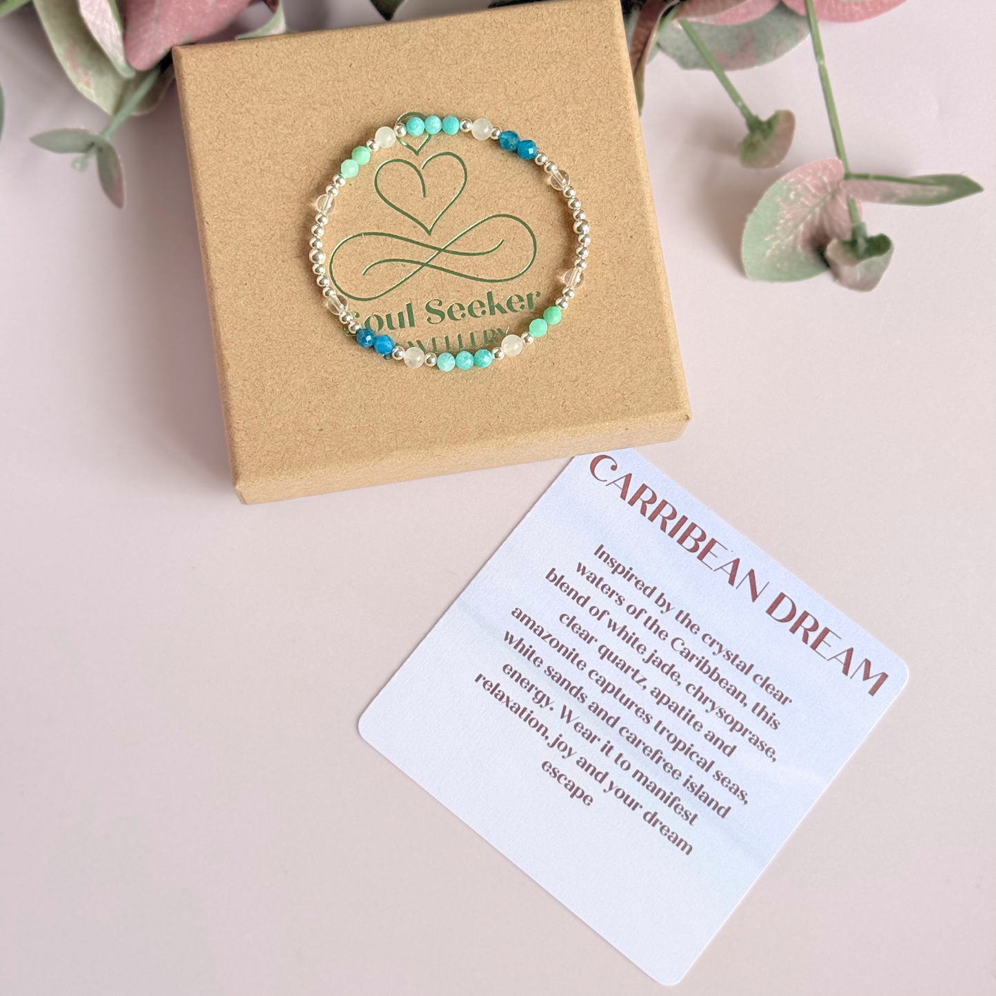 ‘Caribbean Dream' sterling silver dainty beaded bracelet with white jade, chrysoprase, amazonite, apatite and clear quartz. Made with round 3mm sterling silver beads and 4mm smooth and faceted round crystal gemstone beads. Pictured on the gift box, with the crystal information card