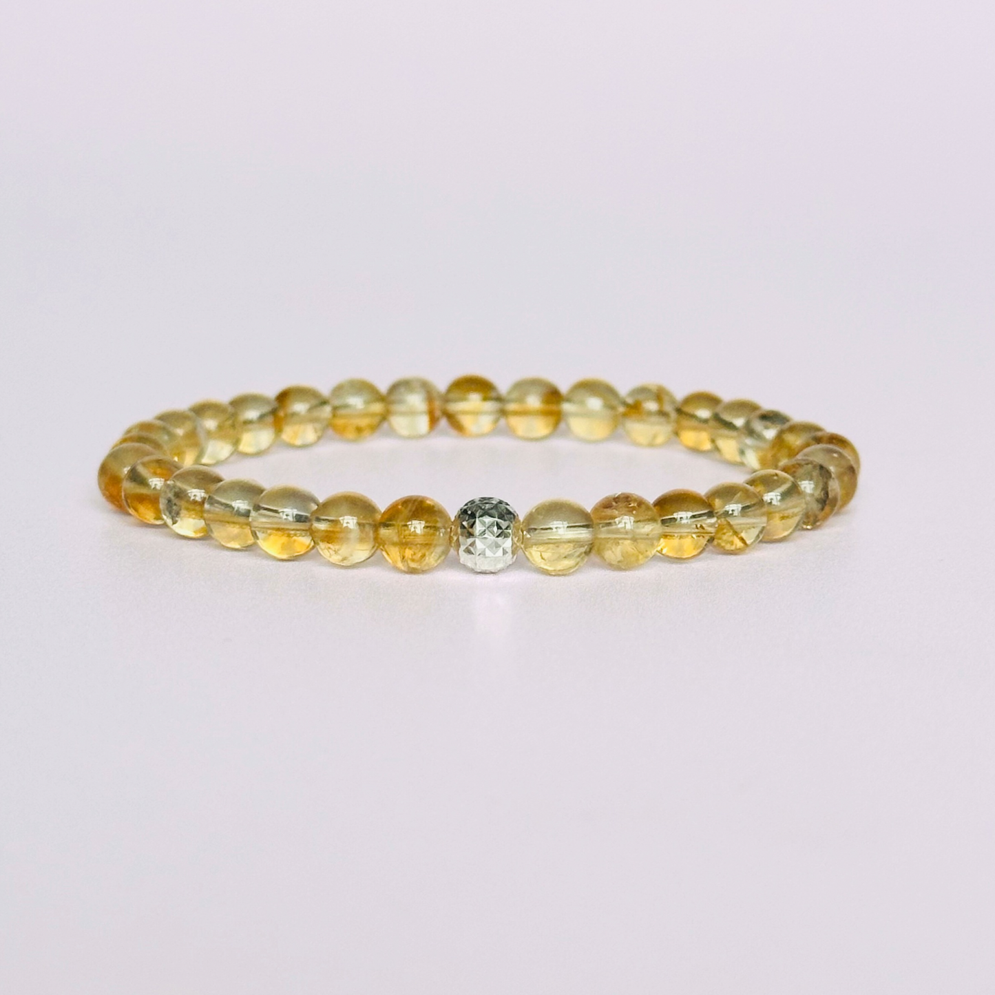 Citrine bracelet with a faceted sterling silver or gold vermeil focal bead. A bracelet to promote abundance and joy. Made with 6mm beads.