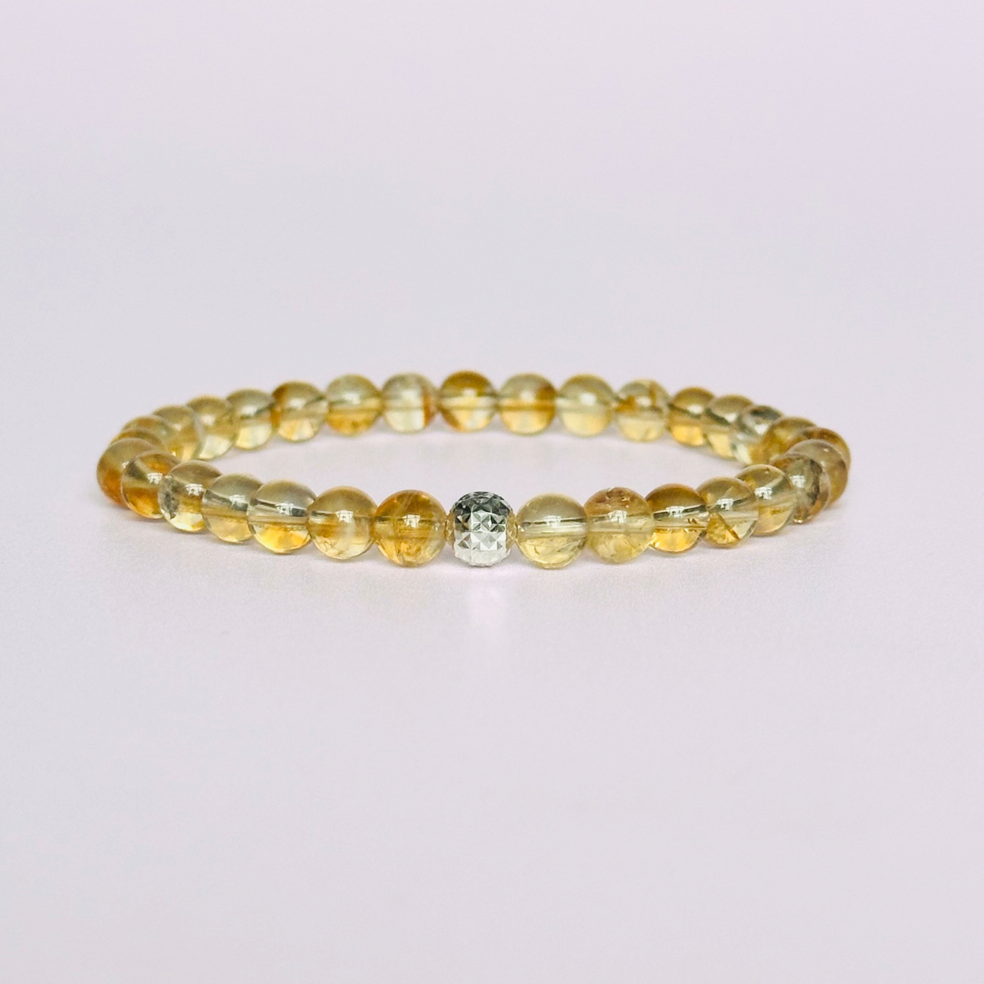 Citrine bracelet with a faceted sterling silver or gold vermeil focal bead. A bracelet to promote abundance and joy. Made with 6mm beads.