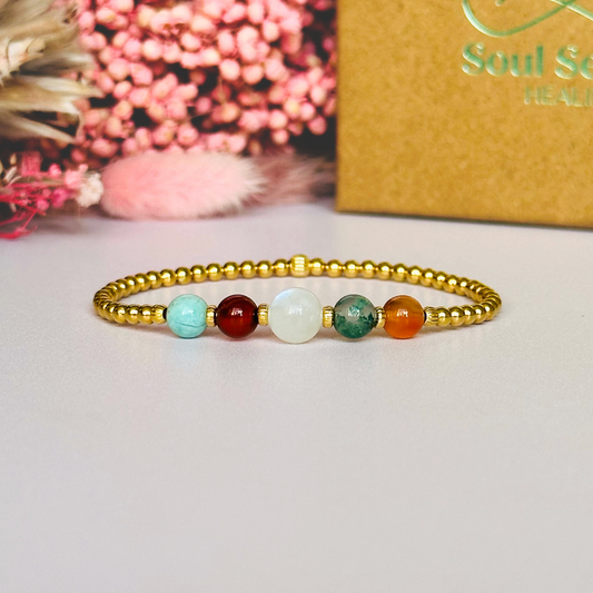 This gold vermeil Virgo bracelet is made with a selection of five healing crystals all believed to resonate with the Virgo zodiac sign. The central bead is 8mm, the other four are 6mm. On an elasticated band of 3mm gold vermeil beads with corrugated accent beads. Featuring amazonite, carnelian, moonstone, moss agate and sardonyx.