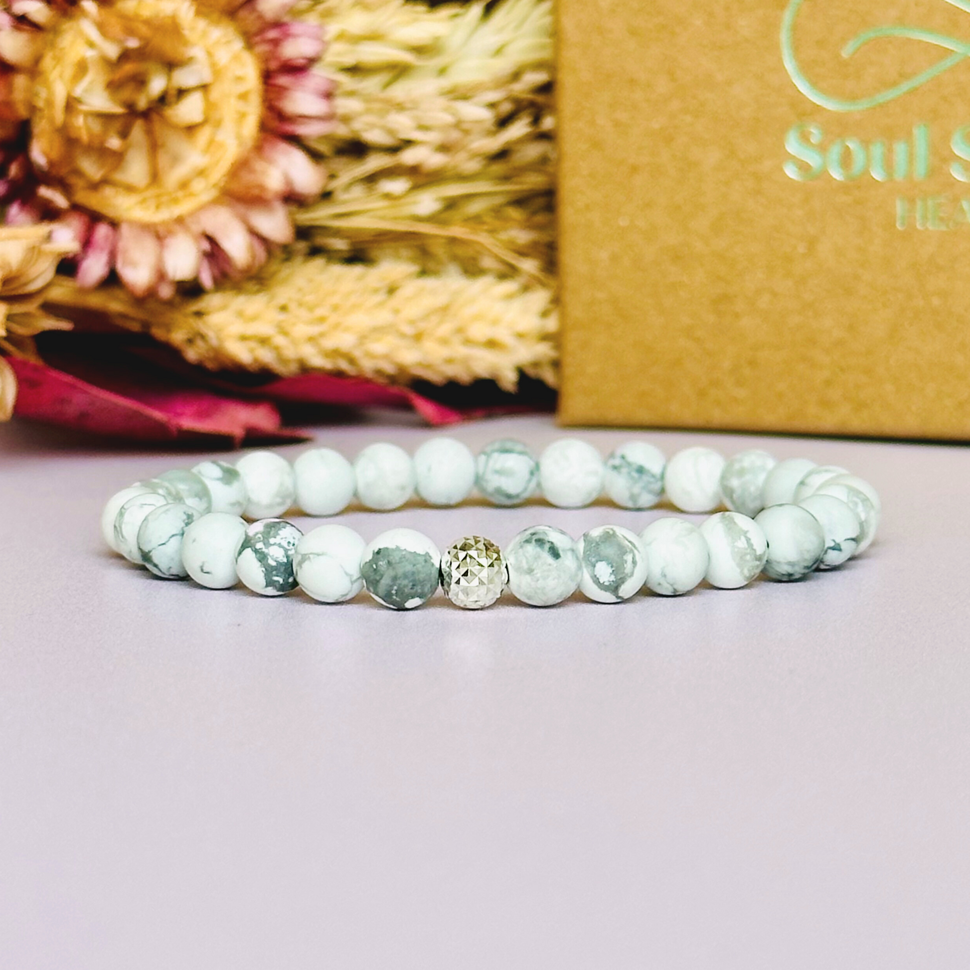 This howlite bracelet is made with ethically mined frosted howlite smooth crystal beads and features your choice of a sterling silver or gold vermeil faceted focal bead. A bracelet for emotional healing, calm and memory. All beads are 6mm.
