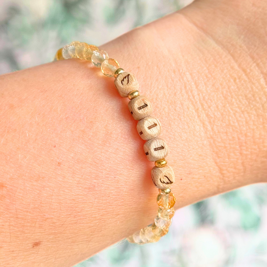 Bracelet featuring engraved wooden 111 angel number and wing beads, on the band of 4mm faceted citrine round crystal gemstone beads. Finished with your choice of gold vermeil, sterling silver or rose gold vermeil accent beads.