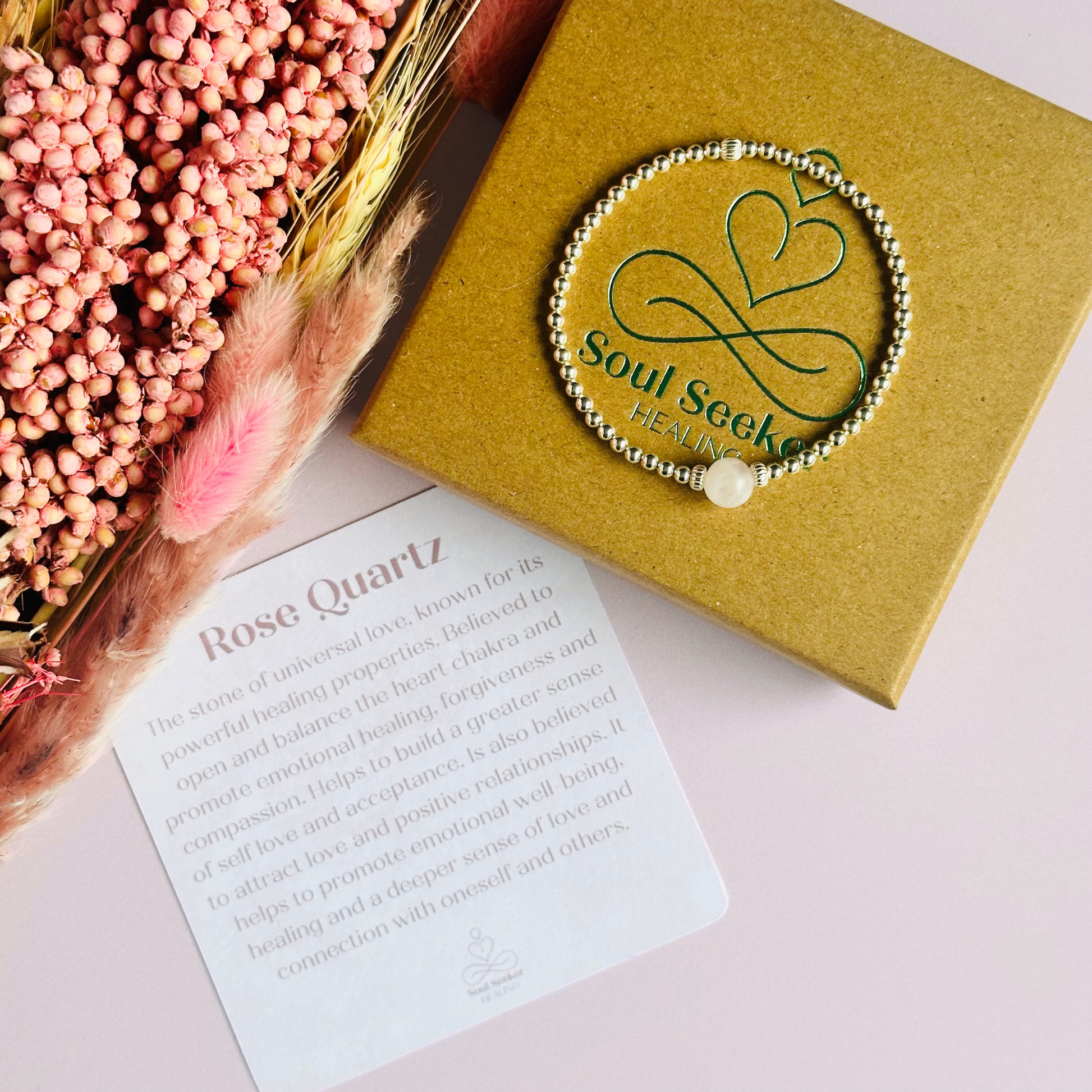 sterling silver rose quartz  bracelet features an ethically mined 8mm rose quartz bead, flanked by corrugated rondelle beads on a band of 3mm sterling silver beads. A bracelet to promote self love and self-confidence.