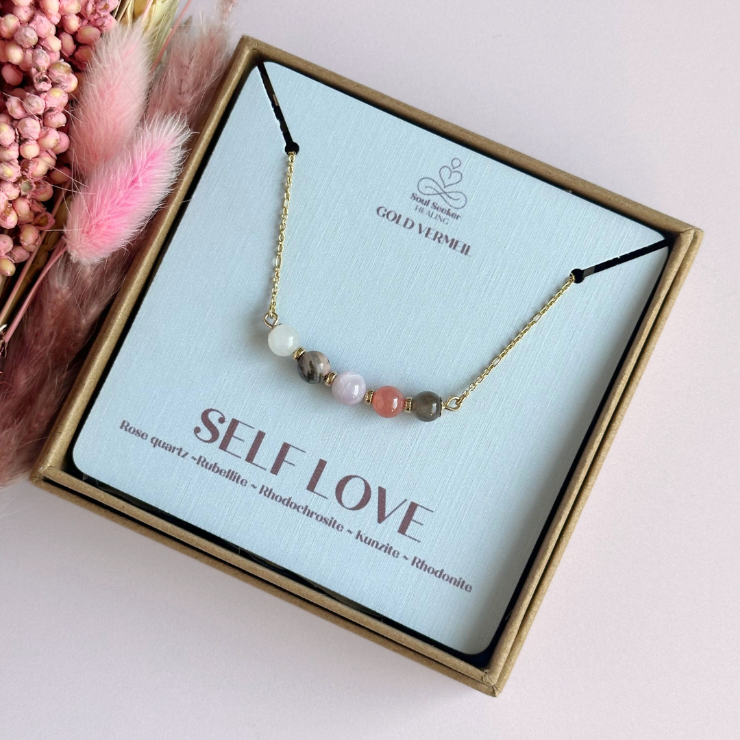 A dainty self love crystal necklace made with a selection of five healing crystals all believed to help promote self love. On a fine, gold vermeil figaro chain, which fastens with a gold vermeil bolt clasp. Featuring corrugated gold vermeil spacer beads and accented with daisy shaped bead caps.