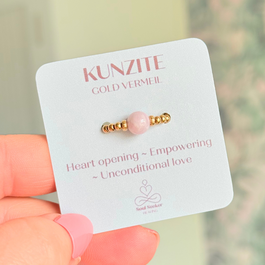 Crystal ring with a 6mm kunzite round bead on an elasticated ring band of 2.5mm gold vermeil ball beads.