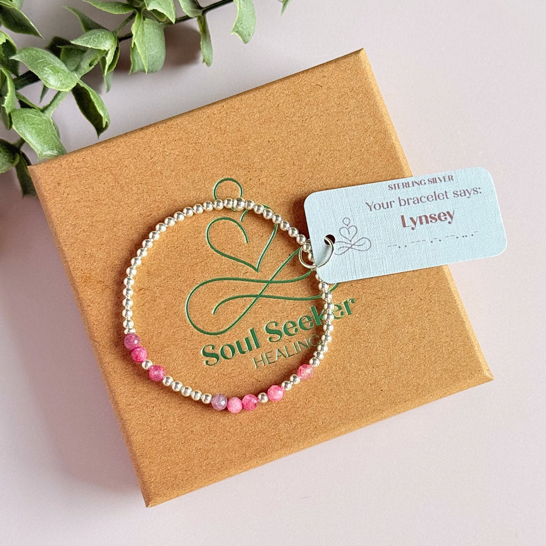 Morse code secret message bracelet spelling out your chosen name in sterling silver and pink tourmaline crystal beads. Elasticated with 4mm faceted pink tourmaline beads and 3mm sterling silver beads. Custom October birthstone bracelet.