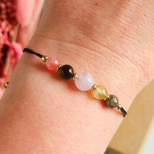Cord bracelet made with five crystals all believed to help with self-confidence. Including pyrite, citrine, rose quartz, tigers eye and rhodochrosite. With your choice of cord colour and choice of either sterling silver, gold vermeil or rose gold vermeil accent beads.