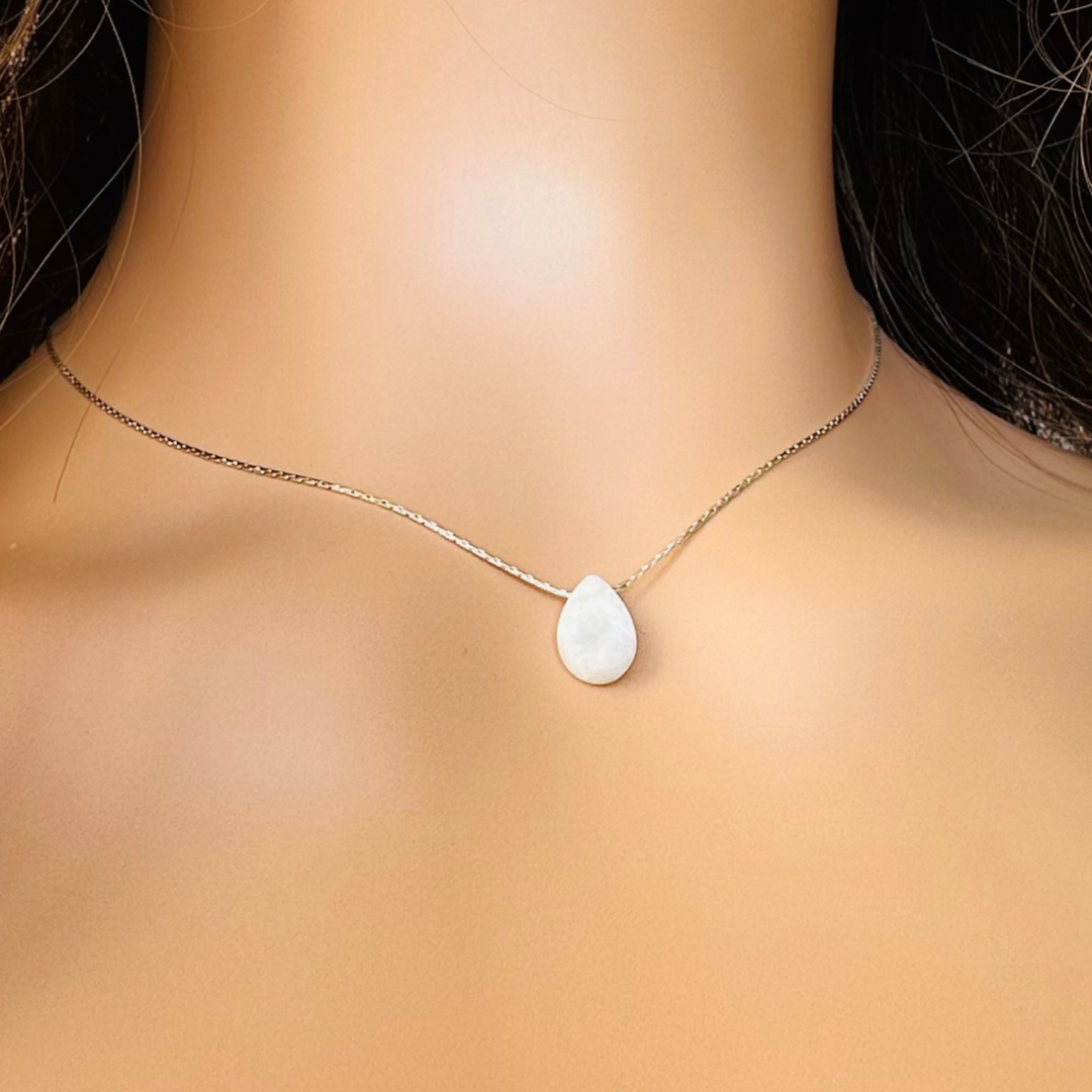 Dainty moonstone teardrop necklace featuring a 12x8mm faceted moonstone teardrop bead on a fine sterling silver cardano beading chain.
