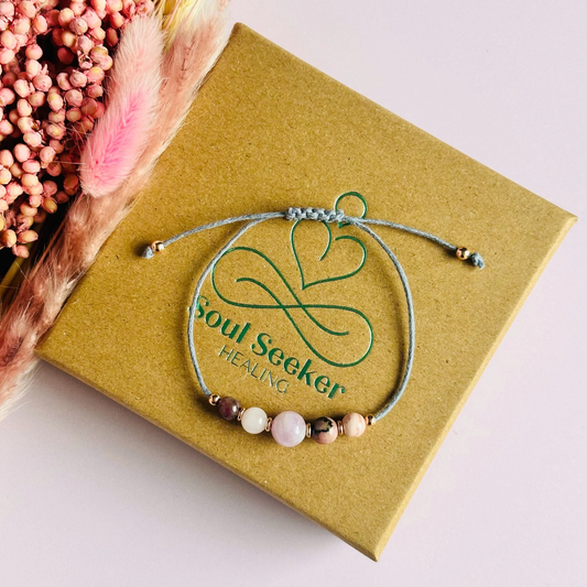 Cord bracelet made with five crystals all believed to help with self-love. Including kunzite, rubellite, rose quartz, rhodonite and rhodochrosite. With your choice of cord colour and choice of either sterling silver, gold vermeil or rose gold vermeil accent beads. Vegan friendly waxed cotton cord.