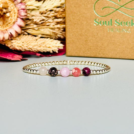 This sterling silver self love bracelet is made with a selection of five healing crystals all believed to help in achieving self love. The crystal beads are all 6mm and are on a band of 3mm sterling silver beads with corrugated accent beads.