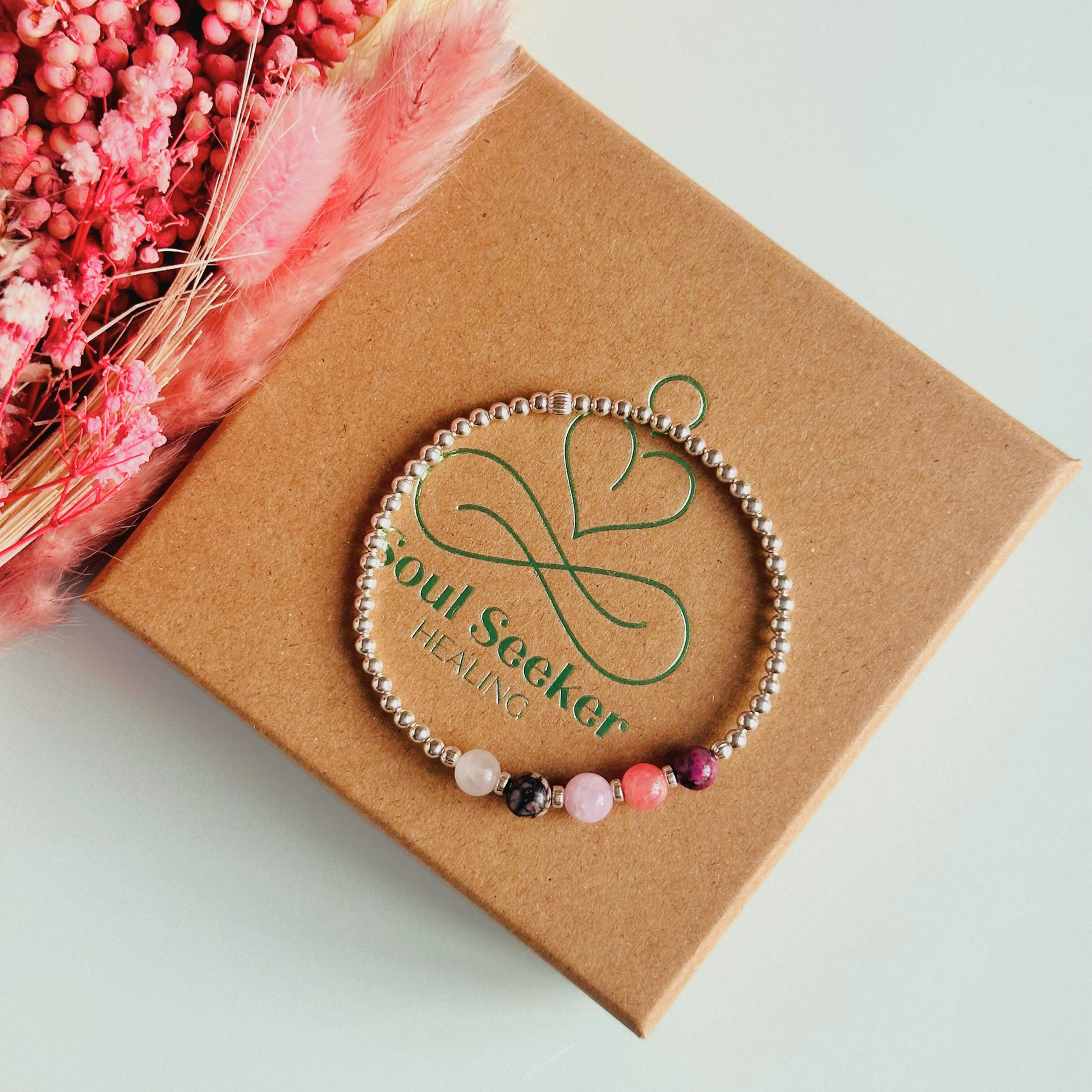 This sterling silver self love bracelet is made with a selection of five healing crystals all believed to help in achieving self love. The crystal beads are all 6mm and are on a band of 3mm sterling silver beads with corrugated accent beads.