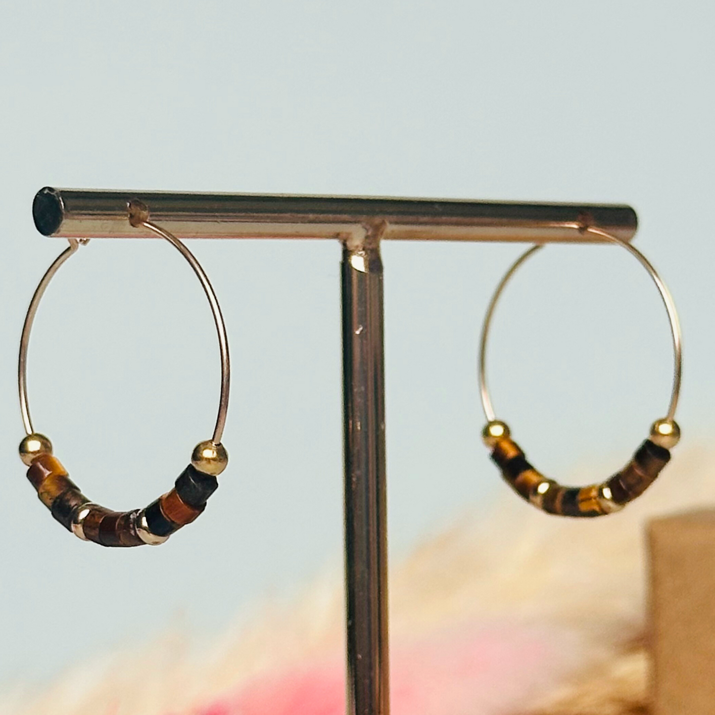 Tigers eye gold filled hoop earrings with ethically mined tigers eye heishi beads on 25mm gold filled hoops.