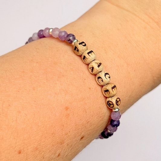 Bracelet featuring 5mm engraved wooden beads which you can personalise with your choice of words, numbers and symbols. The main the band of the bracelet is made with 4mm faceted lepidolite round crystal gemstone beads. Finished with your choice of gold vermeil, sterling silver or rose gold vermeil accent beads.